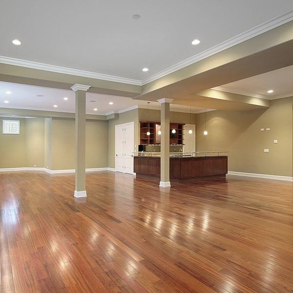 hardwood flooring can be installed over existing tile or carpet with the proper preparation